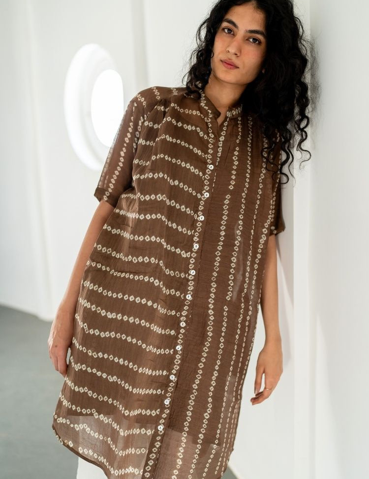 bandhej designer dresses The Bandhani Hand Print Dress is a beautiful and unique piece of clothing that features a colorful and intricate hand-printed design. The dress is made from high-quality fabric and is perfect for