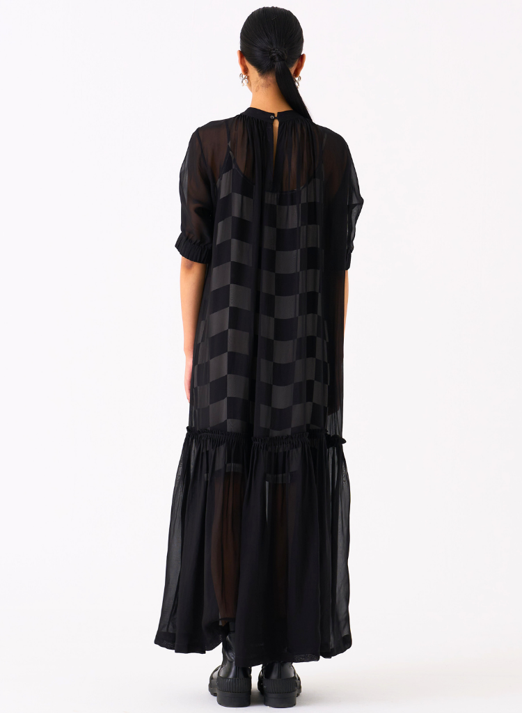 sheer bottom dress Overlay Long hugging bengaline fabric offers a flattering silhouette High neckline creates an elegant By Anthropologie + Sleeveless Sheer